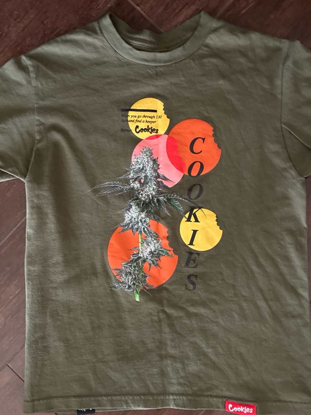 NWOT Cookies Olive Green Graphic Tee with Orange & Yellow Print